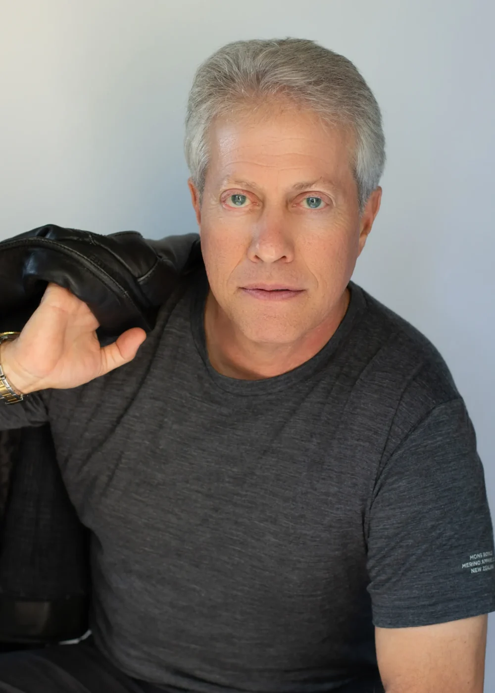 Scott Shimberg leather coat over shoulders PNG